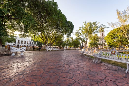 View of the main plaza in Valladolid, Mexico with the cathedral in the background