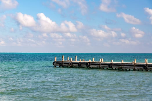 View of a pier extending out into the Caribbean Sea in Punta Allen in the Sian Kaan Biosphere Reserve near Tulum, Mexico