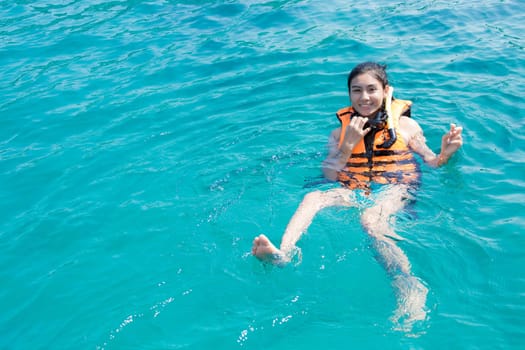 Beautiful woman snorkeling in Krabi Thailand