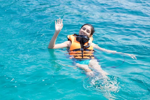 Beautiful woman snorkeling in Krabi Thailand