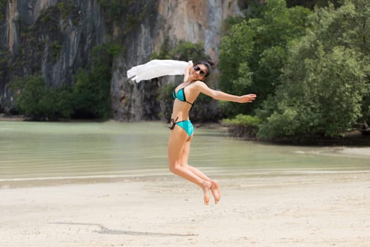 Beautiful young girl on tropical island beach