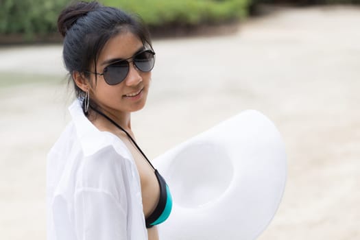 Beautiful young girl on tropical island beach