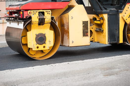 Road roller at work. Work of asphalting a road.