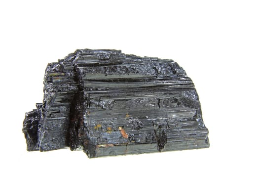 Crystal aggregate of tourmaline exposed against a white background