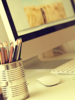 Creatives workspace with selective focus on traditional art pencils