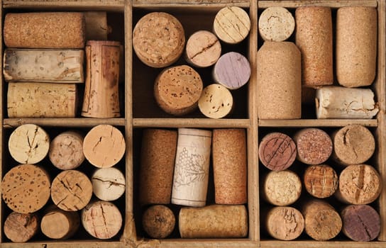 Bottle cork in an old wooden box using as background or header