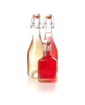 Three bottles of juice on a white background