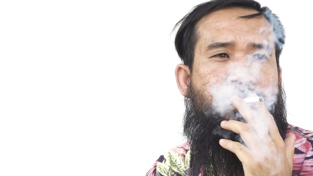 Portrait of adult man who is smoking cigarette