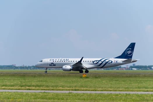 SCHIPHOL, NETHERLANDS - JUNE 4, 2016: A KLM Skyteam plane takes off at amsterdam international airport. SkyTeam is an alliance between different global airlines