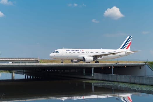 SCHIPHOL, NETHERLANDS - JUNE 4, 2016: Air France-KLM airplane taxiing to the runway on amsterdam schiphol airport