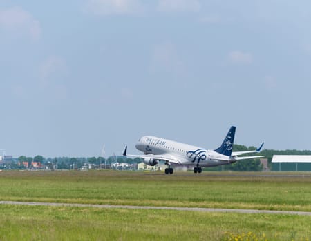 SCHIPHOL, NETHERLANDS - JUNE 4, 2016: A KLM Skyteam plane takes off at amsterdam international airport. SkyTeam is an alliance between different global airlines