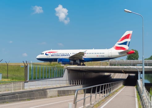 SCHIPHOL, NETHERLANDS - JUNE 4, 2016: British airways airplane taxiing to the runway on amsterdam schiphol airport