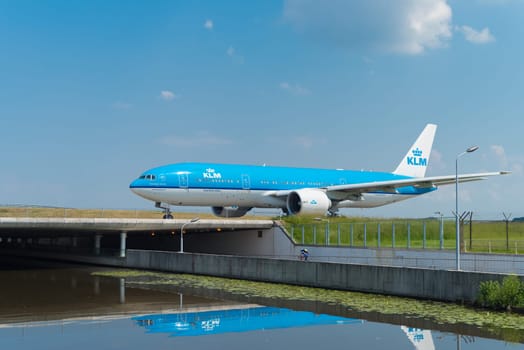 SCHIPHOL, NETHERLANDS - JUNE 4, 2016: Air France-KLM airplane taxiing to the runway on amsterdam schiphol airport