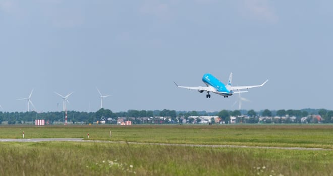 SCHIPHOL, NETHERLANDS - JUNE 4, 2016: KLM airplane takes off at amsterdam international airport. There are 163 destinations served by KLM