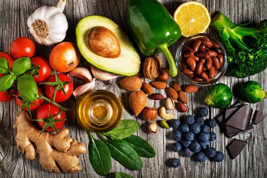 Selection of healthy food on wooden background. Healthy diet foods for heart cholesterol and diabetes.