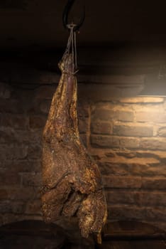 Domestic smoked meat produced in the dark basement