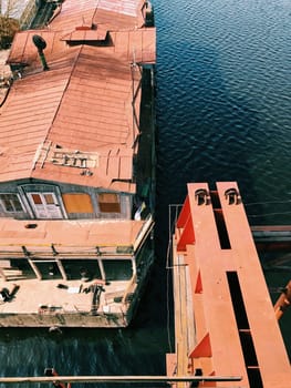 Rusty vintage abandoned ship ferry in old port
