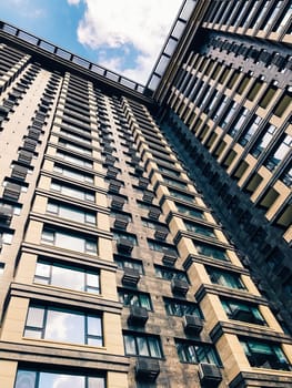 Top part of high-rise business building on blue sky