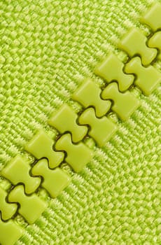 Abstract background green closed zipper diagonally located