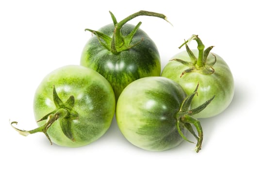 Four green tomatoes near isolated on white background