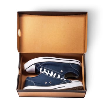 Dark blue sports shoes inside cardboard box isolated on white background