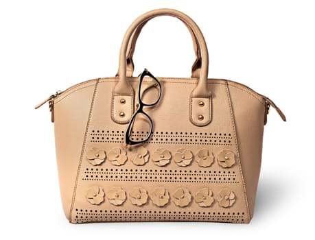 Elegant beige handbag and glasses isolated on white background