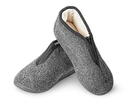 Dark gray slippers with fur one on another isolated on white background