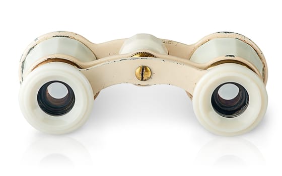 In front old vintage pair of opera glasses horizontally isolated on white background