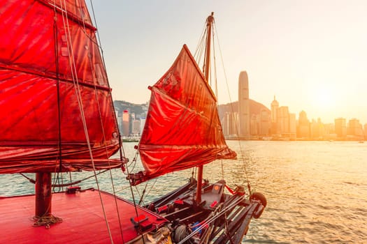 Sailboat In Hong Kong Harbour at sunset.