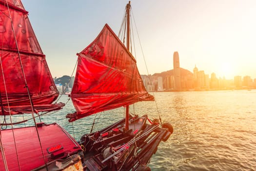 Sailboat In Hong Kong Harbour at sunset.