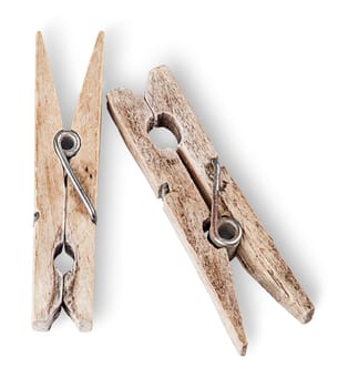 Two old wooden clothespins beside isolated on white background