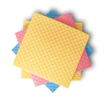 Multicolored sponges for dishwashing in chaotic order top view isolated on white background