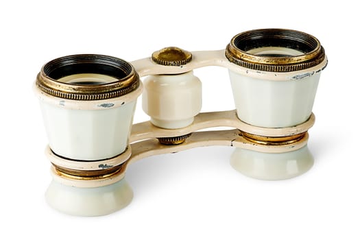 Old vintage pair of opera glasses vertically flipped isolated on white background