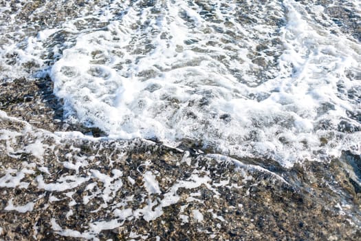 Soft wave of Black sea on sandy beach. Nature Background