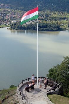 The Hungarian flag with beautiful landscape background in Visegrad.