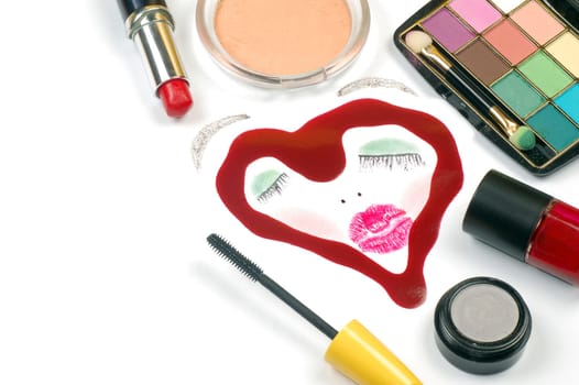 Painted female face in heart shape with different cosmetics, beauty products.
