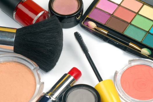 Colorful different make-up and beauty products are on white background.