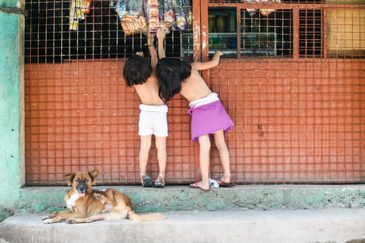 Cebu, Philippines - October 01, 2014. Children play in the yard. Everyday life of filipinos