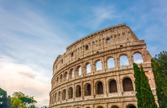 view on the Great Roman Colosseum Coliseum, Colosseo ,also known as the Flavian Amphitheatre. Famous world landmark. Scenic urban landscape. Rome. Italy. Europe
