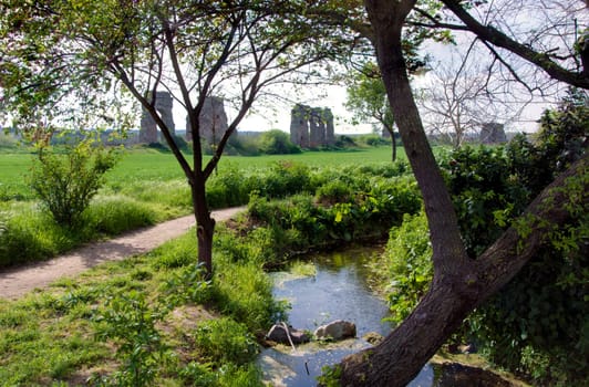 The Parco degli Acquedotti is a public park in Rome, Italy. It is part of the Appian Way Regional Park and is of approximately 240 ha. The park is named after the aqueducts that go through it. It is crossed on one side by the Aqua Felix and also contains part of the Aqua Claudia