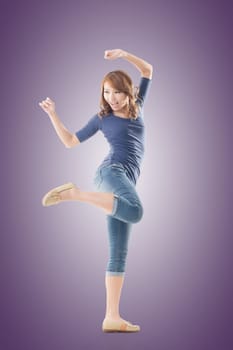 Excited Asian young girl, full length portrait isolated.