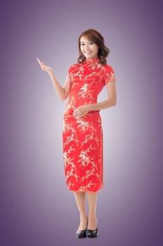 Chinese woman dress traditional cheongsam at New Year and introducing, full length portrait isolated.