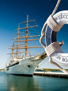 view on the sailing ship thrue blue safe belt with welcome on board sign