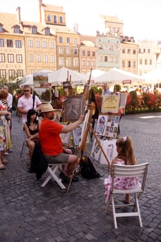 The Zamkowy Square in the old Town in the City of Warsaw in Poland.