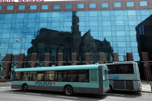 A city bus in front of the Hotel Panorama in the city centre of Wroclaw or Wroclaw in the west of Poland.