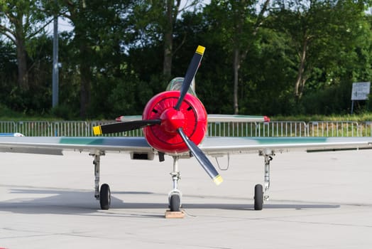 LEEUWARDEN, NETHERLANDS - JUNE 10, 2016: parked Yak-52 at the dutch air force open days