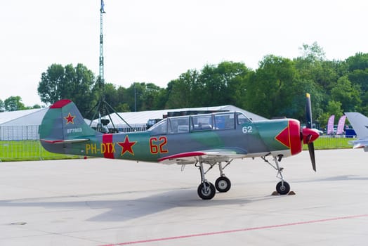 LEEUWARDEN, NETHERLANDS - JUNE 10, 2016: parked Yak-52 at the dutch air force open days