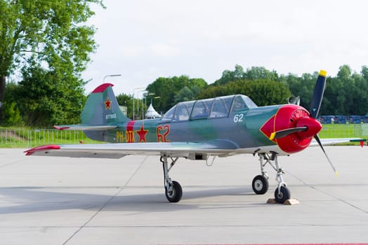 LEEUWARDEN, NETHERLANDS - JUNE 10, 2016: parked Yak-52 at the dutch air force open days