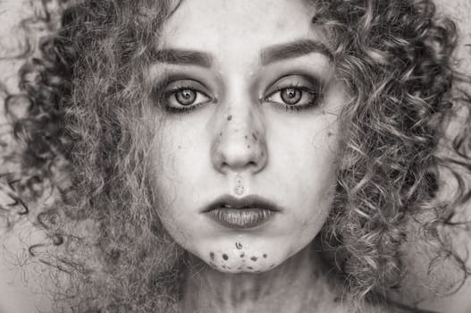 young woman with curls and makeup