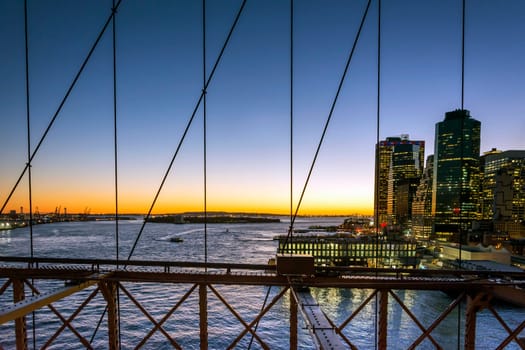 New York at sunset viewed from Brooklyn bridge